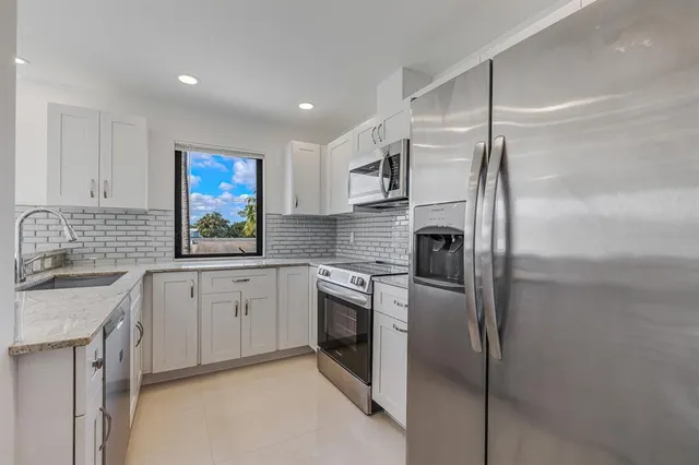 a kitchen with a sink and a window