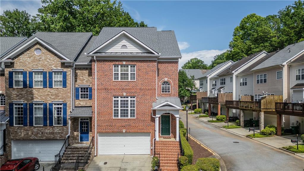 3136 Mercer University Drive Chamblee, GA 30341 - Photo 1 of 1 a front view of a house with garden