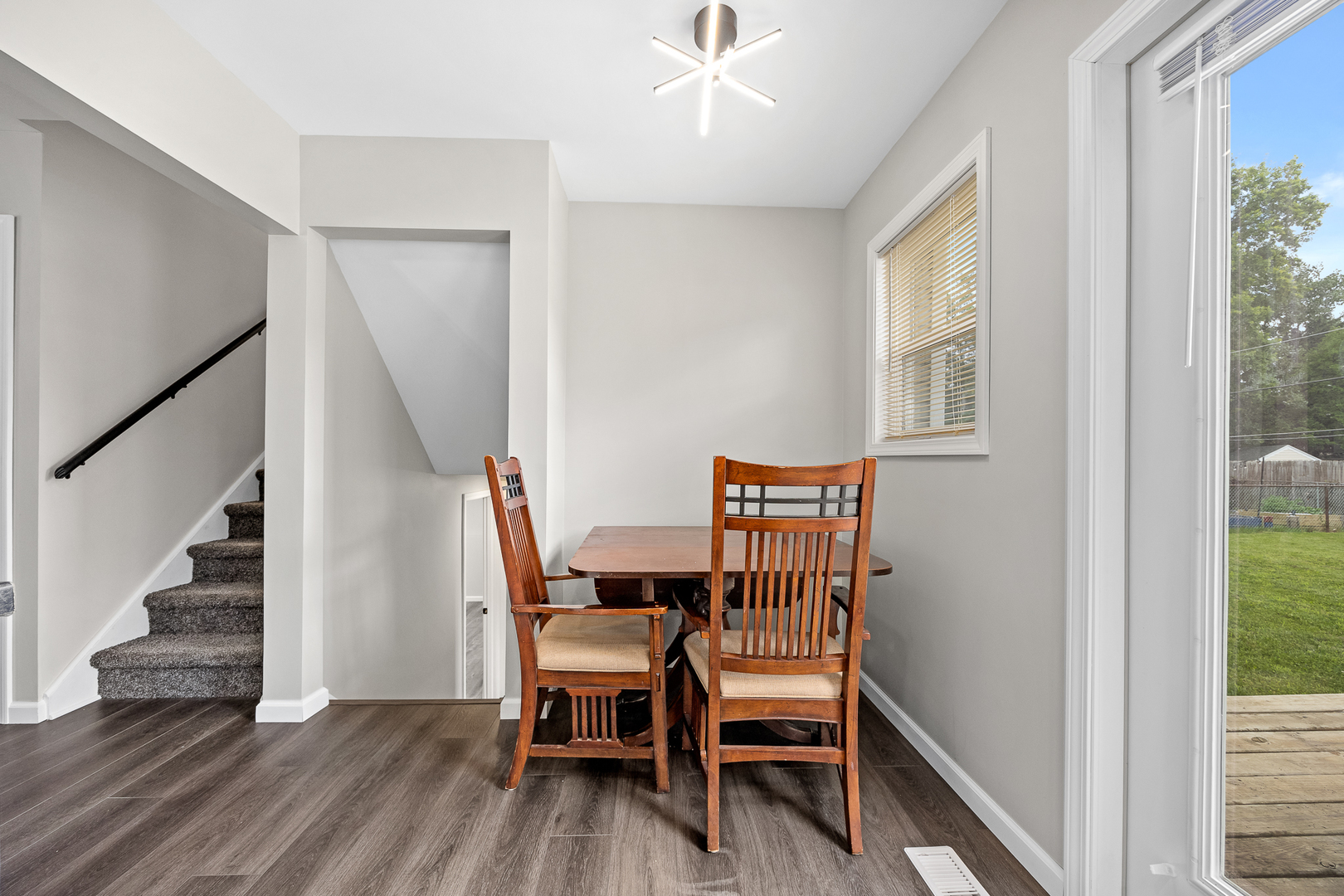 148 Bedford Road Bolingbrook, IL 60440 - Photo 11 of 32 a dining room with furniture and entryway wooden floor