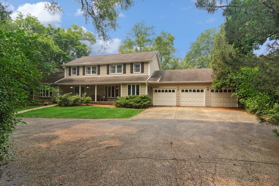 58 Indian Trail Road Lake Barrington, IL 60010 - Photo 1 of 48 a view of a house with a yard and potted plants
