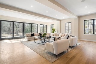 741 Boston Post Road Weston, MA 02493 - Photo 12 of 28 a living room with furniture and a large window