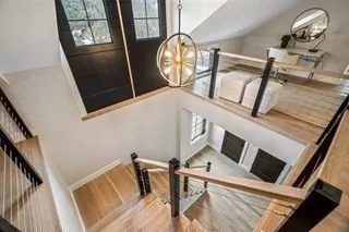 a view of an entryway with wooden floor