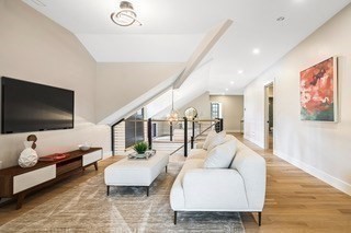 741 Boston Post Road Weston, MA 02493 - Photo 20 of 28 a living room with furniture and a flat screen tv