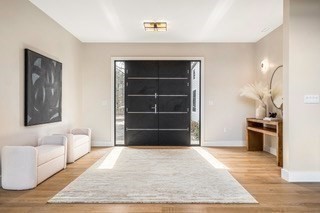 741 Boston Post Road Weston, MA 02493 - Photo 2 of 28 a living room with a couch and a rug