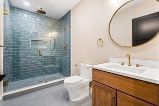 741 Boston Post Road Weston, MA 02493 - Photo 23 of 28 a bathroom with a sink a toilet and shower