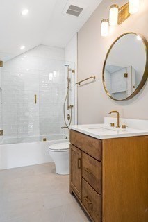 741 Boston Post Road Weston, MA 02493 - Photo 25 of 28 a bathroom with a sink a toilet and a mirror
