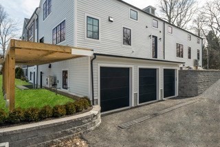 741 Boston Post Road Weston, MA 02493 - Photo 27 of 28 a view of a white house with large windows