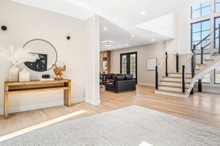 741 Boston Post Road Weston, MA 02493 - Photo 3 of 28 a living room with fireplace furniture and a wooden floor