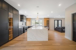 741 Boston Post Road Weston, MA 02493 - Photo 8 of 28 a large white kitchen with kitchen island a large counter top stainless steel appliances and cabinets