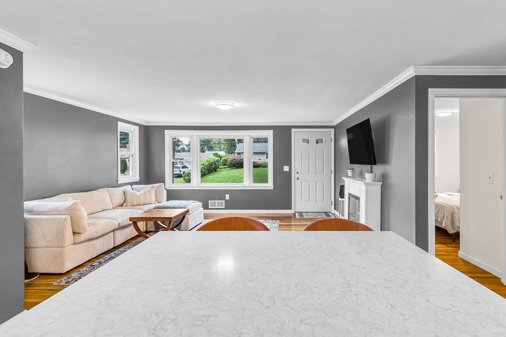 71 Endecott Street Springfield, MA 01118 - Photo 14 of 42 a living room with furniture and a flat screen tv