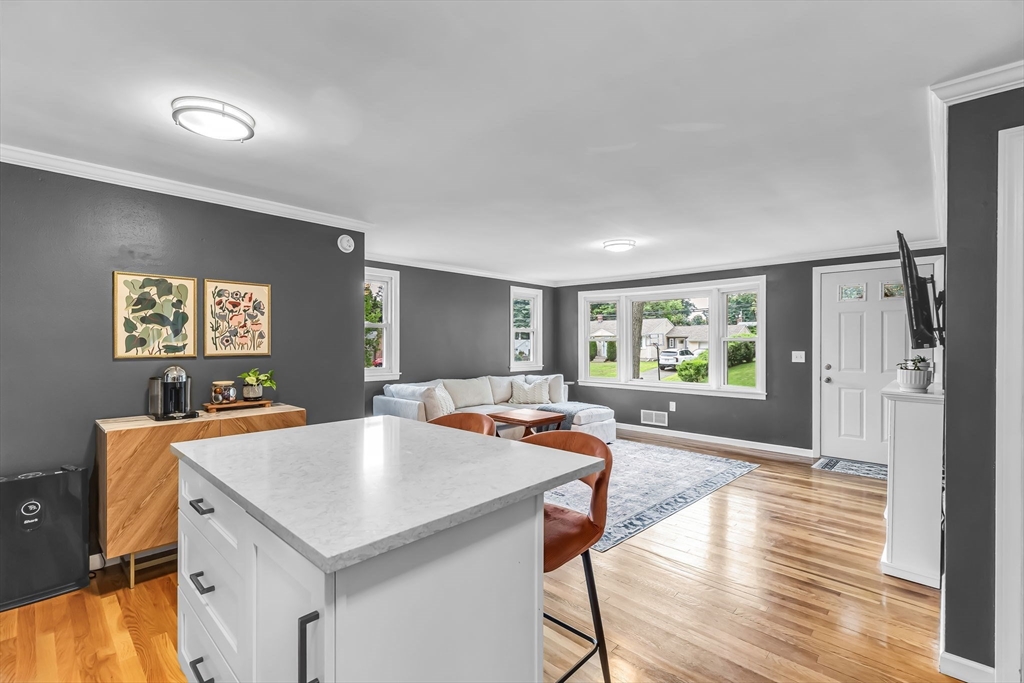 71 Endecott Street Springfield, MA 01118 - Photo 17 of 42 a view of a kitchen with a table and chairs