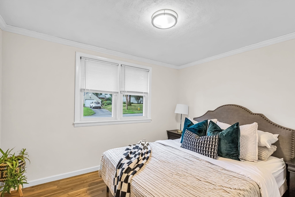 71 Endecott Street Springfield, MA 01118 - Photo 18 of 42 a bedroom with a bed and a window