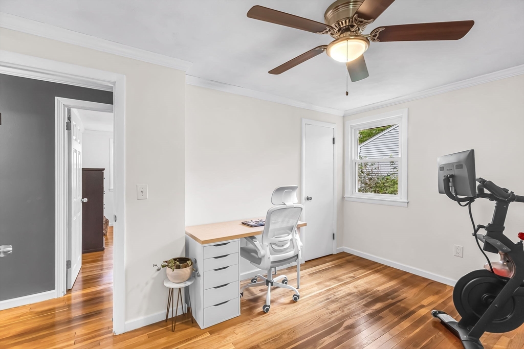 71 Endecott Street Springfield, MA 01118 - Photo 26 of 42 a view of a workspace with furniture and wooden floor
