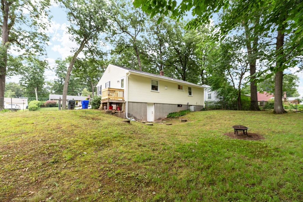 71 Endecott Street Springfield, MA 01118 - Photo 36 of 42 a view of a house with backyard and tree s
