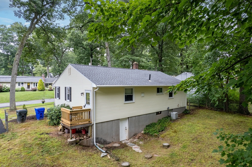 71 Endecott Street Springfield, MA 01118 - Photo 38 of 42 a backyard of a house with table and chairs