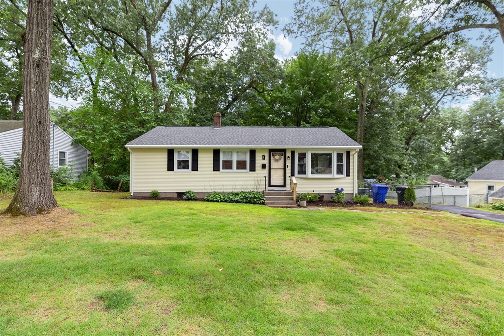 71 Endecott Street Springfield, MA 01118 - Photo 39 of 42 a view of a house with a big yard and large trees