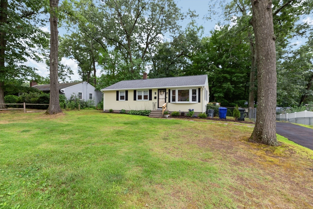 71 Endecott Street Springfield, MA 01118 - Photo 40 of 42 a view of a house with a backyard and a patio