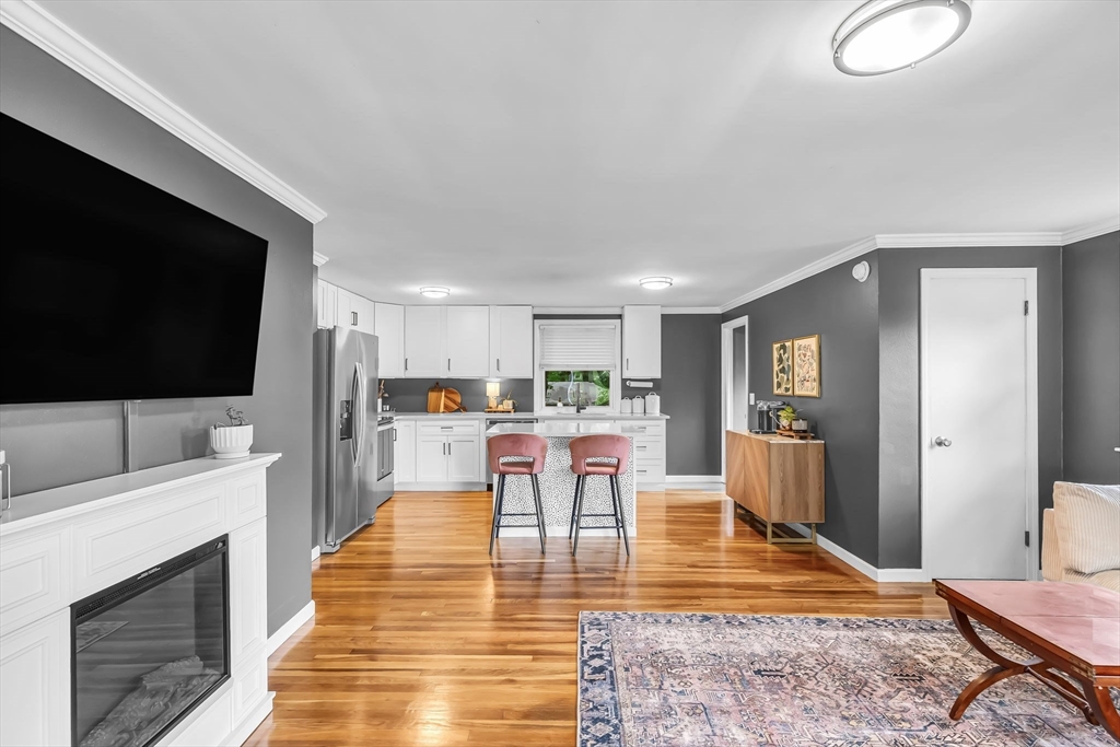 71 Endecott Street Springfield, MA 01118 - Photo 7 of 42 a view of a living room and a flat screen tv