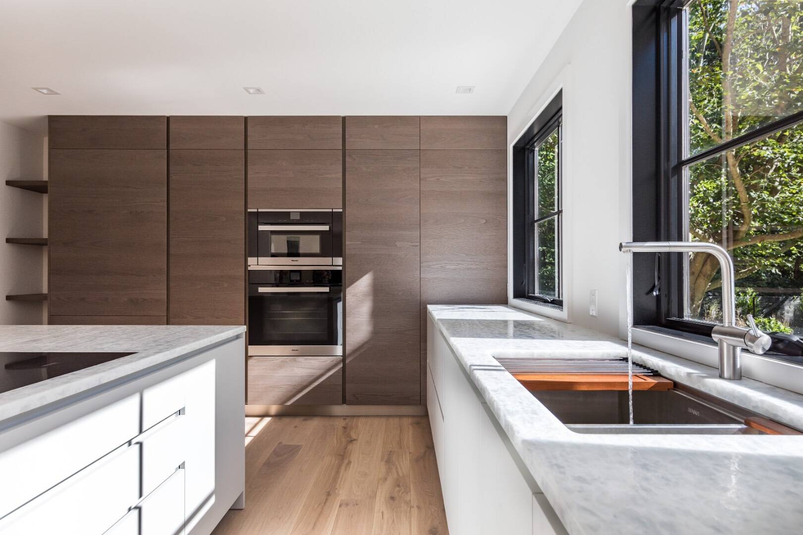 22 Oak Drive Sag Harbor, NY 11963 - Photo 15 of 35 a kitchen with kitchen island granite countertop a sink and counter space
