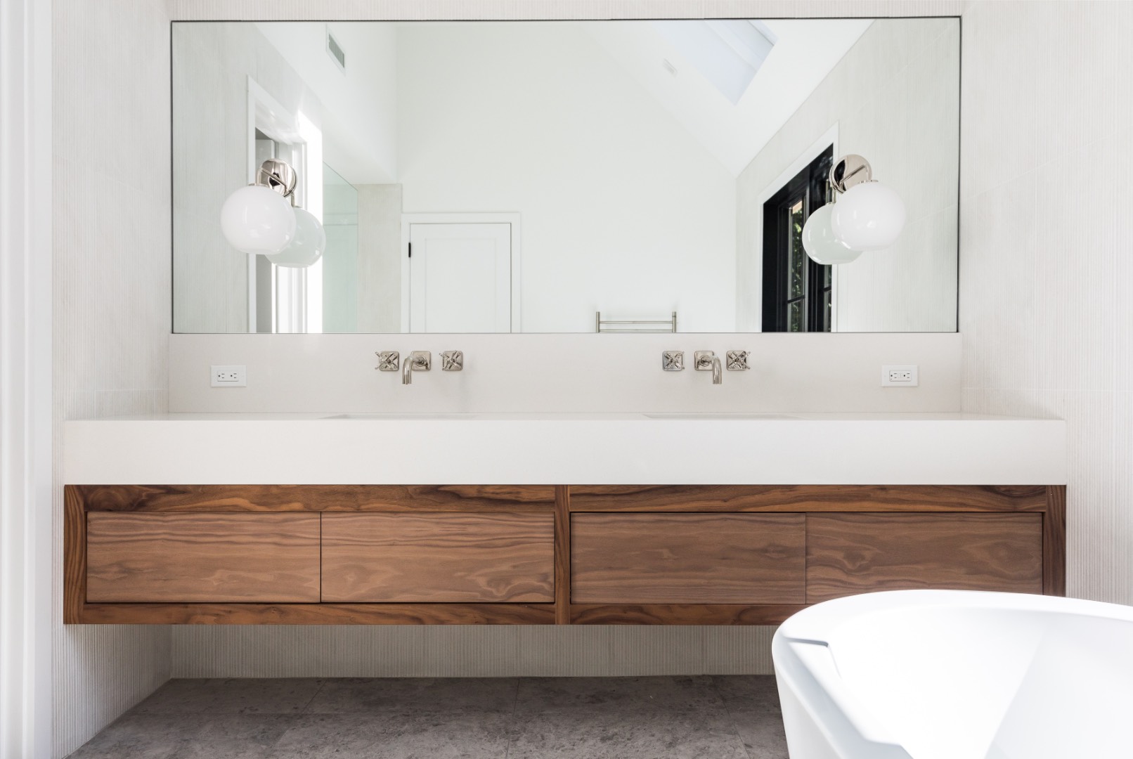 22 Oak Drive Sag Harbor, NY 11963 - Photo 23 of 35 a bathroom with a sink and a mirror