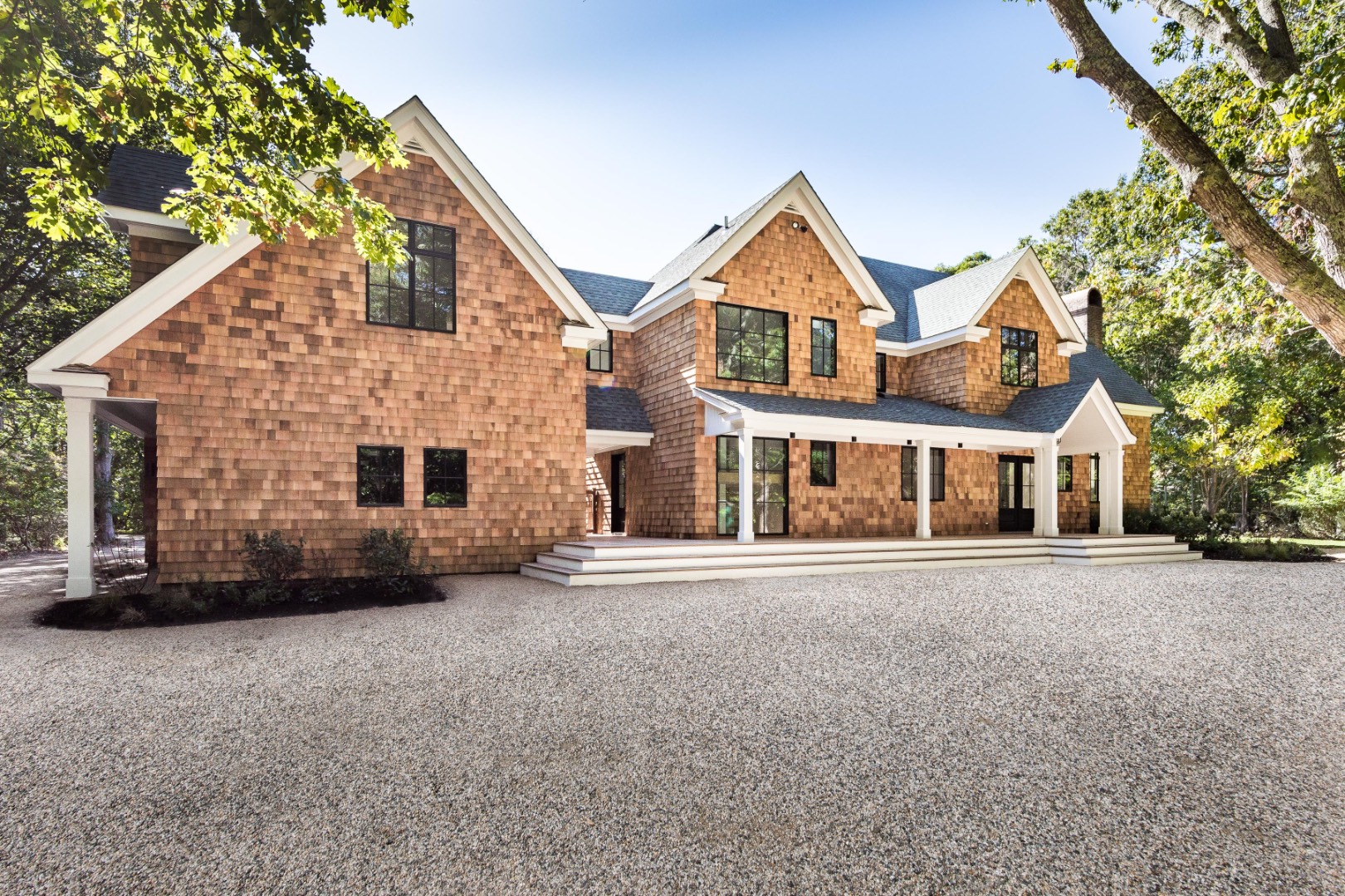 22 Oak Drive Sag Harbor, NY 11963 - Photo 4 of 35 a front view of a house with a yard