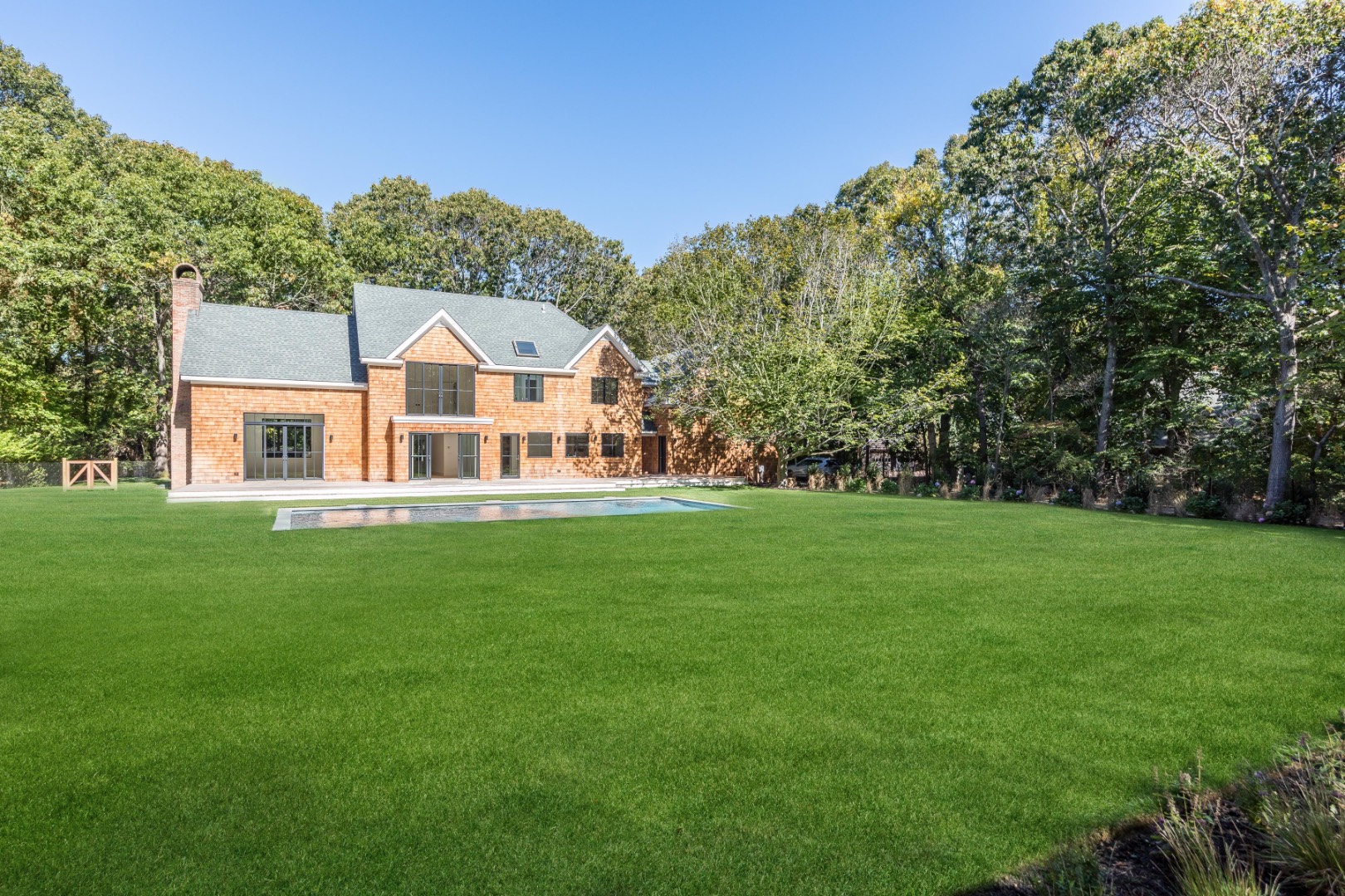 22 Oak Drive Sag Harbor, NY 11963 - Photo 33 of 35 a front view of a house with a yard