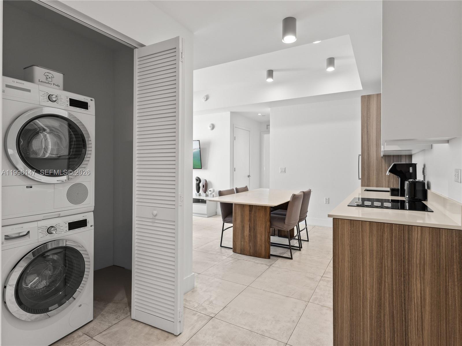 239 Southwest 9th Street, Unit 1403 Miami, FL 33130 - Photo 13 of 33 a view of a kitchen with sink washer and dryer