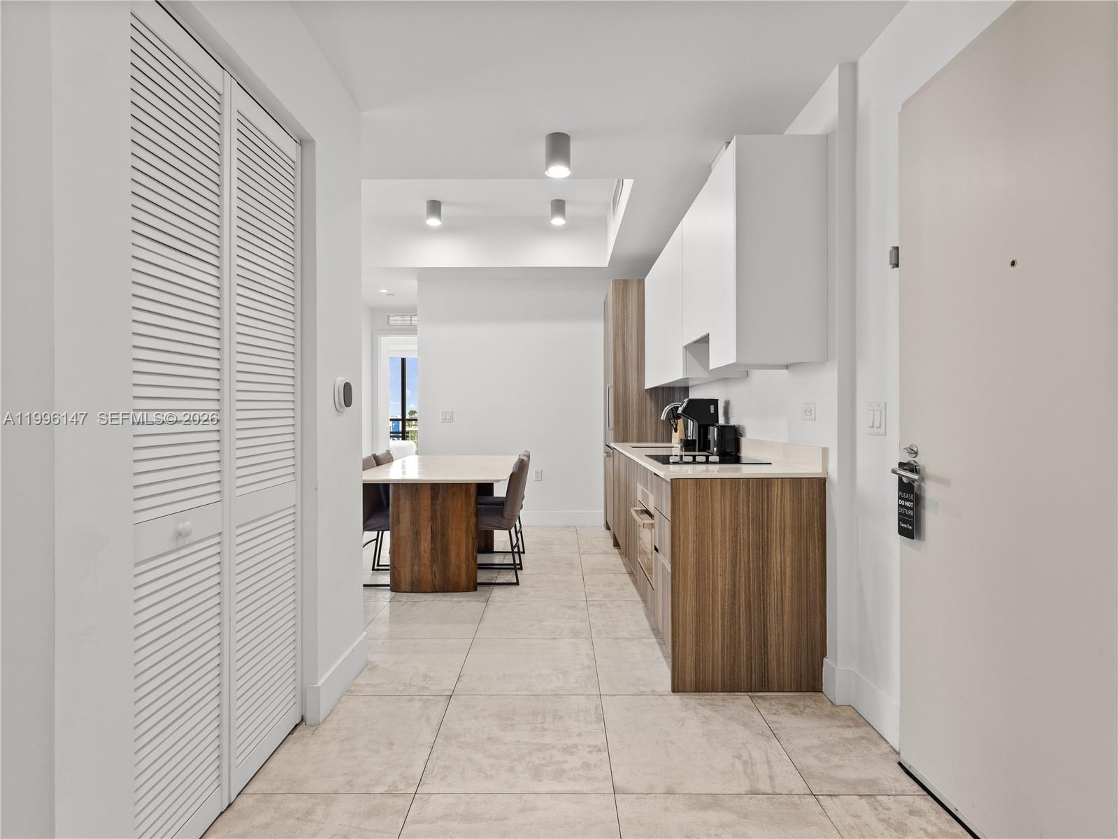 239 Southwest 9th Street, Unit 1403 Miami, FL 33130 - Photo 14 of 33 a view of kitchen with windows and refrigerator