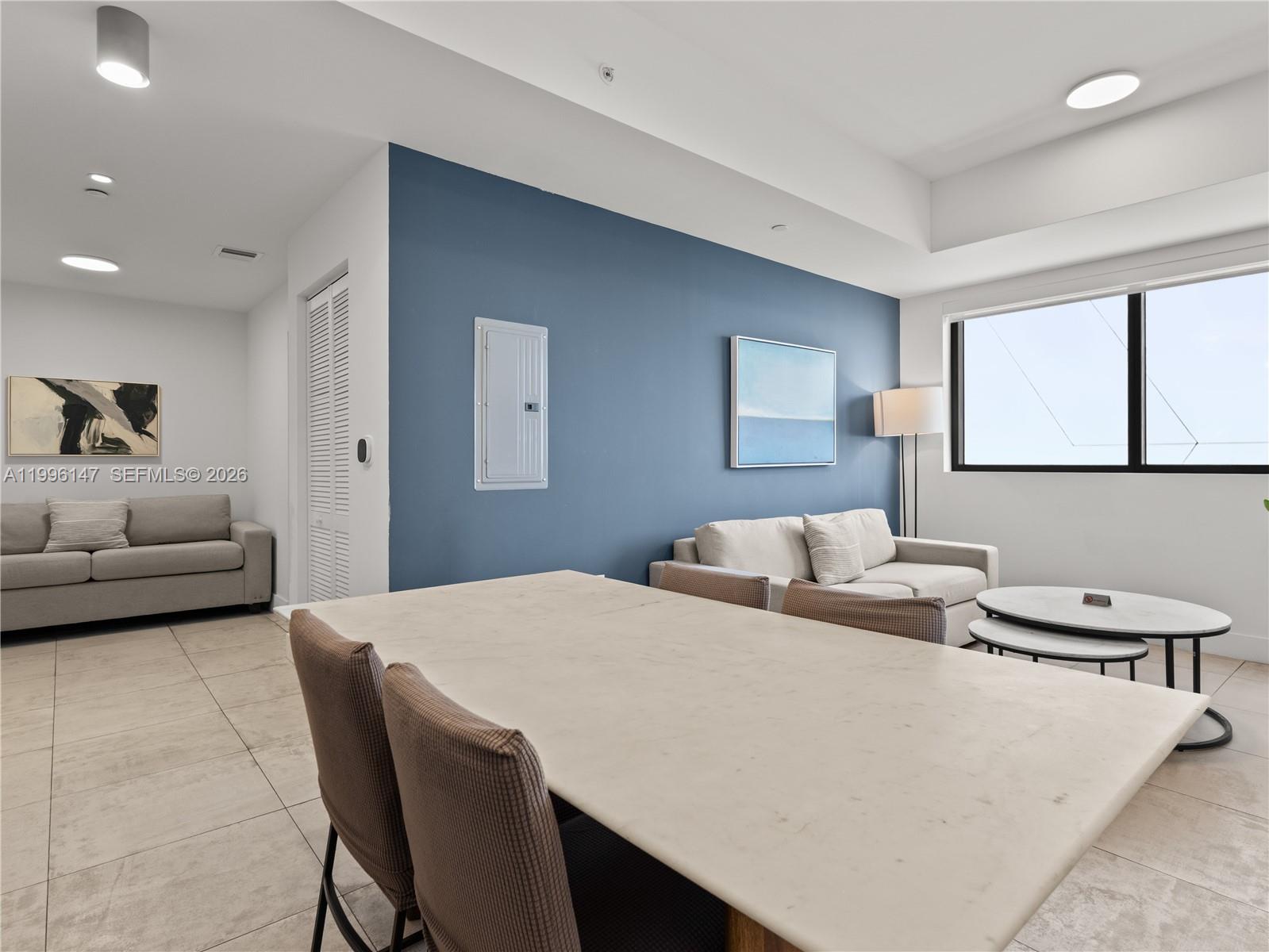 239 Southwest 9th Street, Unit 1403 Miami, FL 33130 - Photo 16 of 33 a bedroom with a bed and a couch