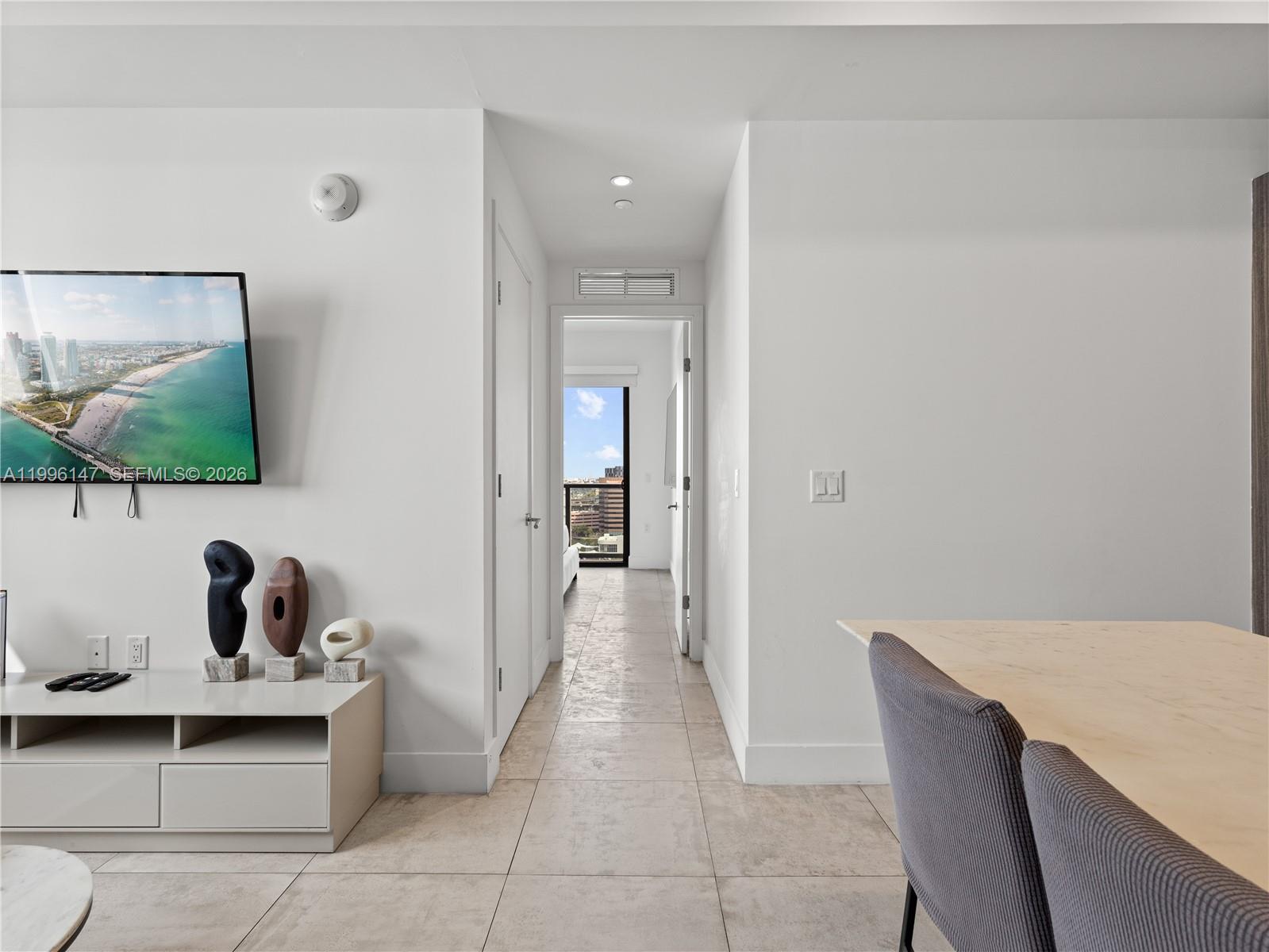 239 Southwest 9th Street, Unit 1403 Miami, FL 33130 - Photo 20 of 33 a view of kitchen with furniture and flat screen tv