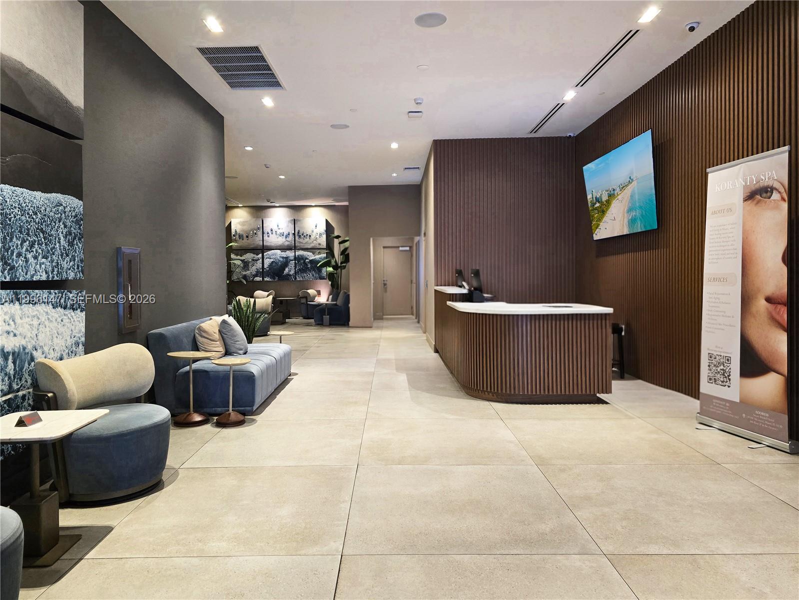 239 Southwest 9th Street, Unit 1403 Miami, FL 33130 - Photo 32 of 33 a living room with furniture and a flat screen tv