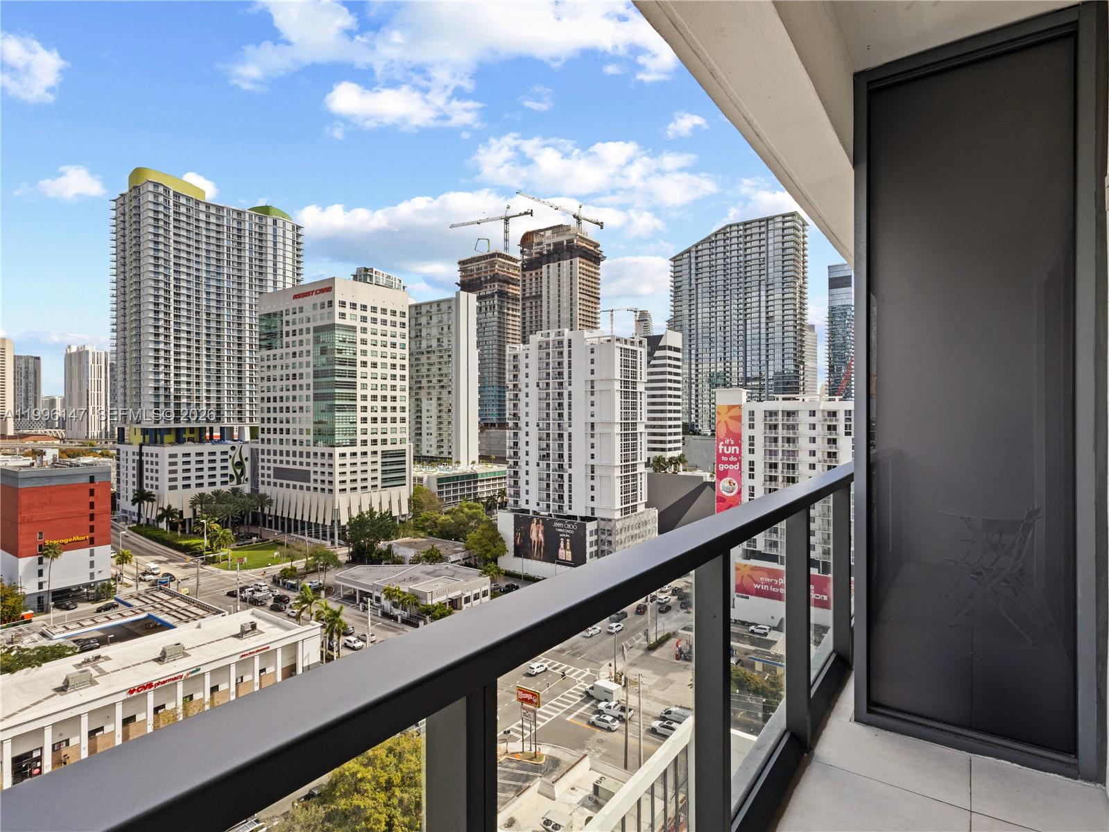 239 Southwest 9th Street, Unit 1403 Miami, FL 33130 - Photo 5 of 33 a city view from a balcony