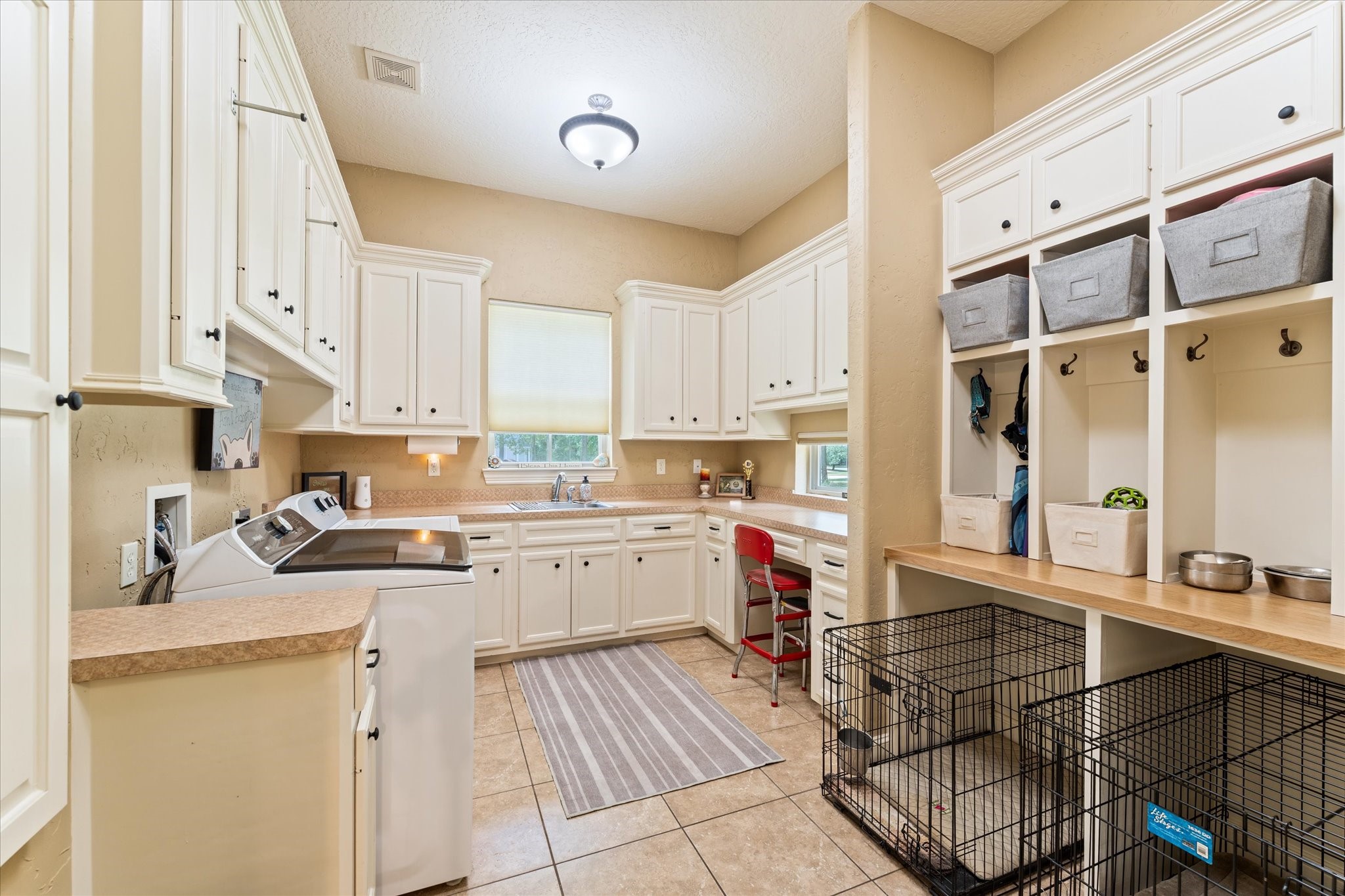 28422 Quiet Way Magnolia, TX 77355 - Photo 20 of 48 Huge laundry rom with TONS of cabinets, sink and built in ironing board