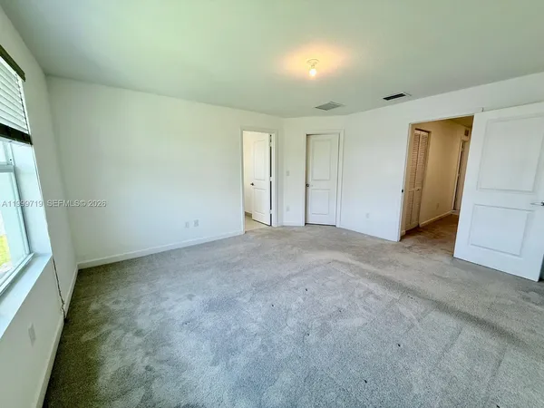 an empty room with windows