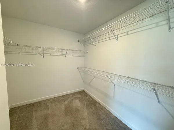 a view of a room with racks on the wall