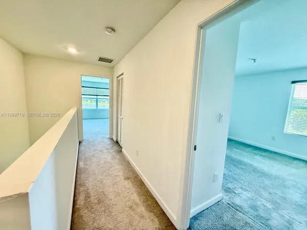 a view of hallway with stairs