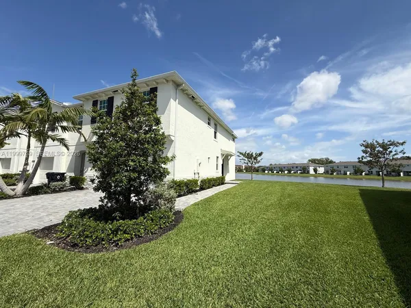 a view of a garden with a house