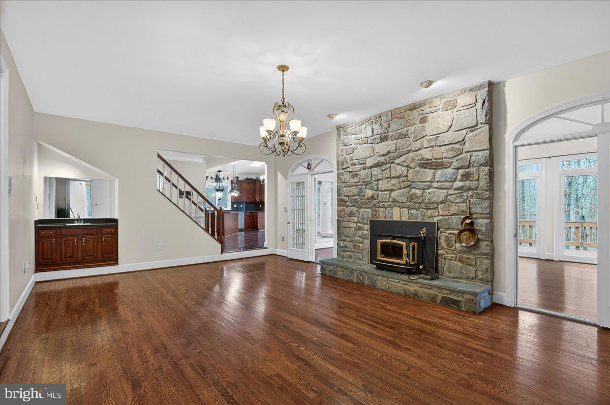 6612 Colchester Road Clifton, VA 20124 - Photo 20 of 93 Step down family room with cozy stone fireplace