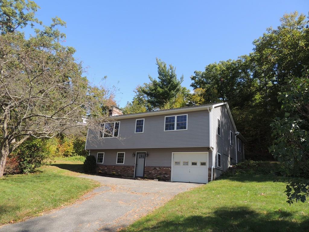 68 Cote Road Monson, MA 01057 - Photo 1 of 24 a front view of a house with a yard and garage