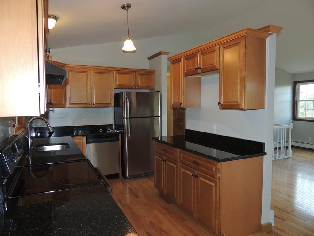 68 Cote Road Monson, MA 01057 - Photo 11 of 24 a kitchen with a refrigerator and a sink