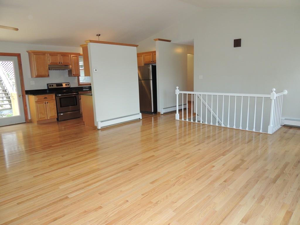 68 Cote Road Monson, MA 01057 - Photo 13 of 24 a view of kitchen with stainless steel appliances kitchen island wooden floor and living room