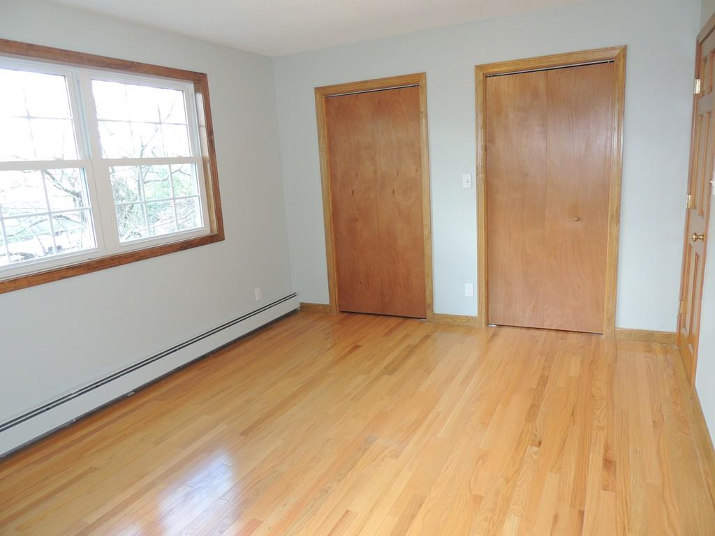 68 Cote Road Monson, MA 01057 - Photo 15 of 24 a view of an empty room with wooden floor and a window