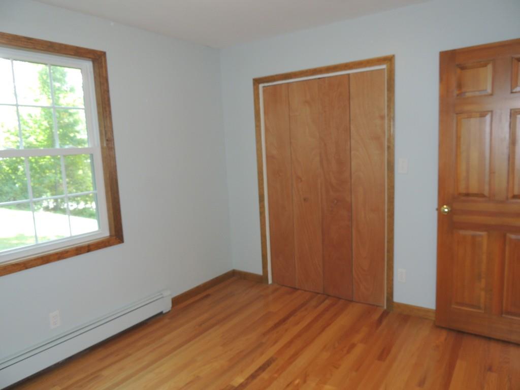 68 Cote Road Monson, MA 01057 - Photo 17 of 24 a view of an empty room with wooden floor and a window