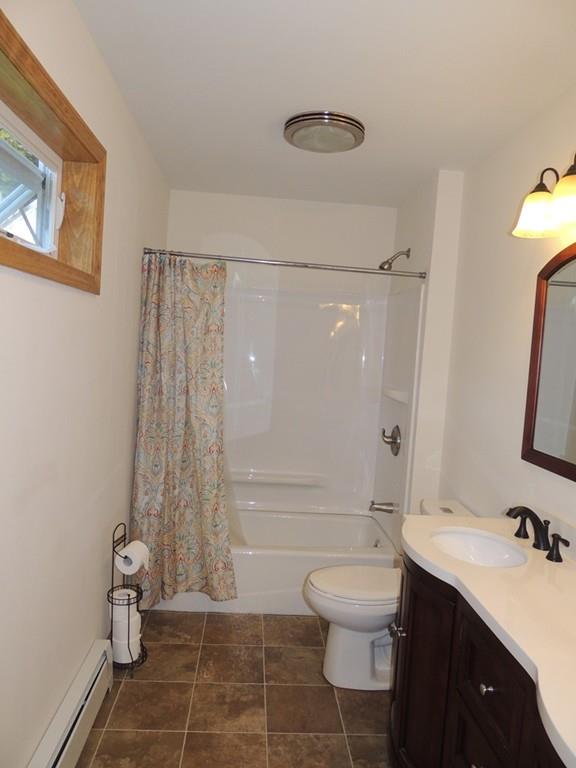 68 Cote Road Monson, MA 01057 - Photo 18 of 24 a bathroom with a granite countertop sink toilet a mirror and shower