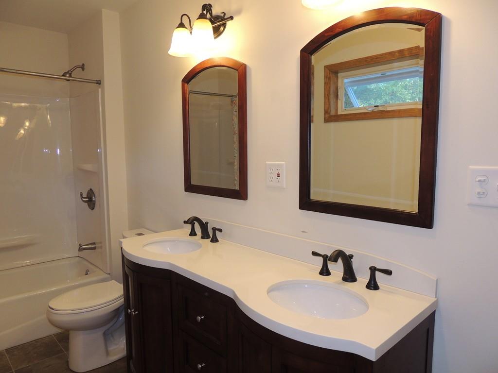 68 Cote Road Monson, MA 01057 - Photo 19 of 24 a bathroom with a toilet sink and mirror