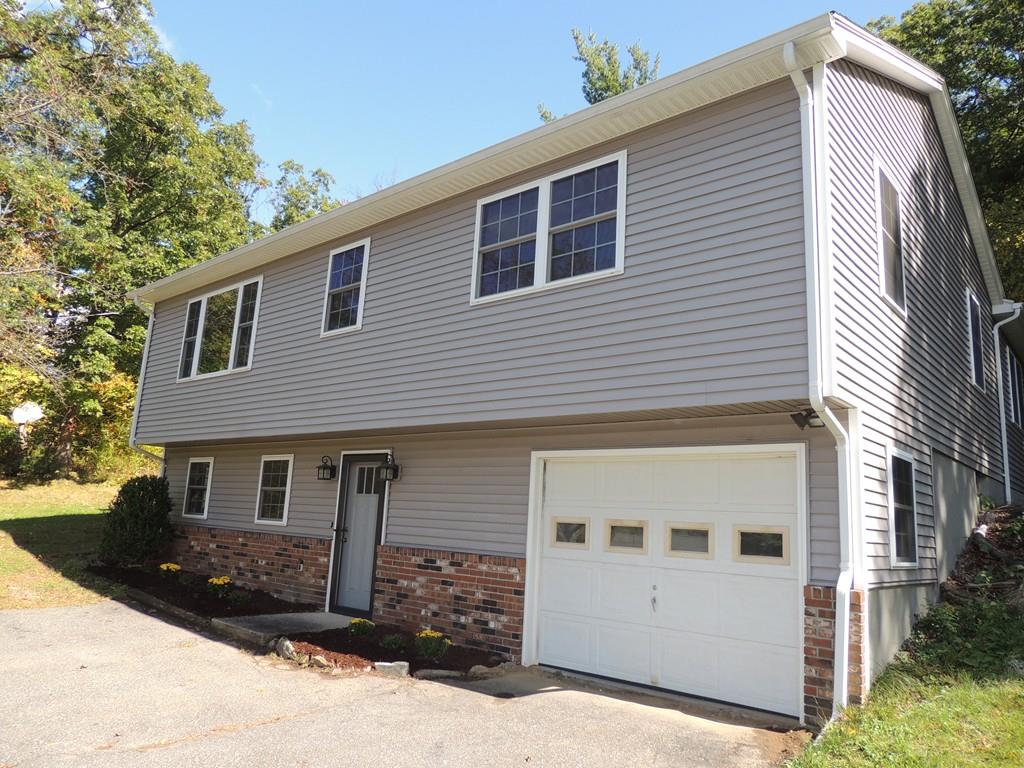 68 Cote Road Monson, MA 01057 - Photo 2 of 24 a front view of a house with a yard