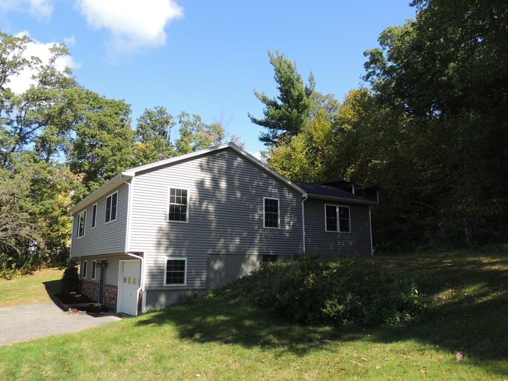 68 Cote Road Monson, MA 01057 - Photo 4 of 24 a view of a house with yard and plants next to a yard