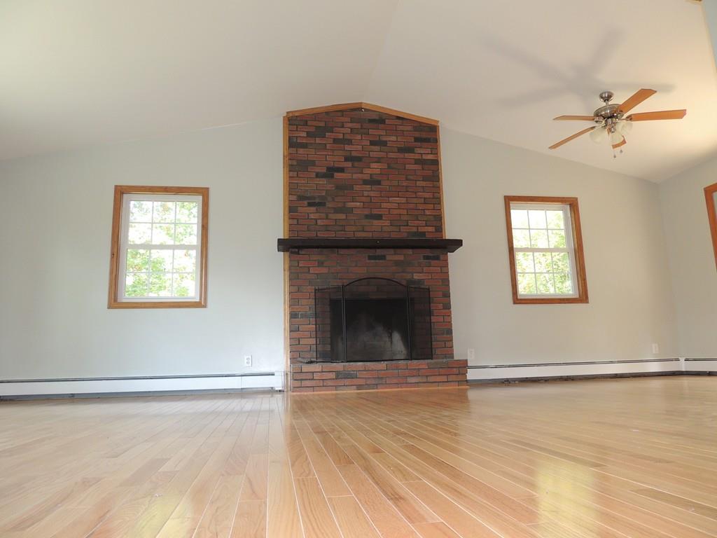68 Cote Road Monson, MA 01057 - Photo 7 of 24 a view of an empty room with window and a fireplace