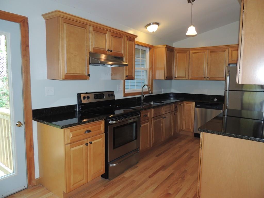 68 Cote Road Monson, MA 01057 - Photo 10 of 24 a kitchen with granite countertop a sink a counter space appliances and cabinets
