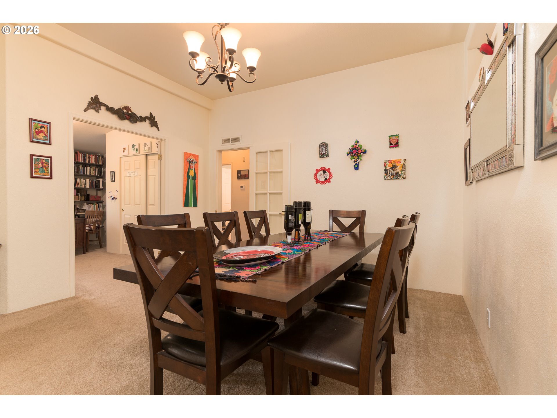 1157 8th Street Bandon, OR 97411 - Photo 11 of 46 a view of a dining room with furniture and chandelier